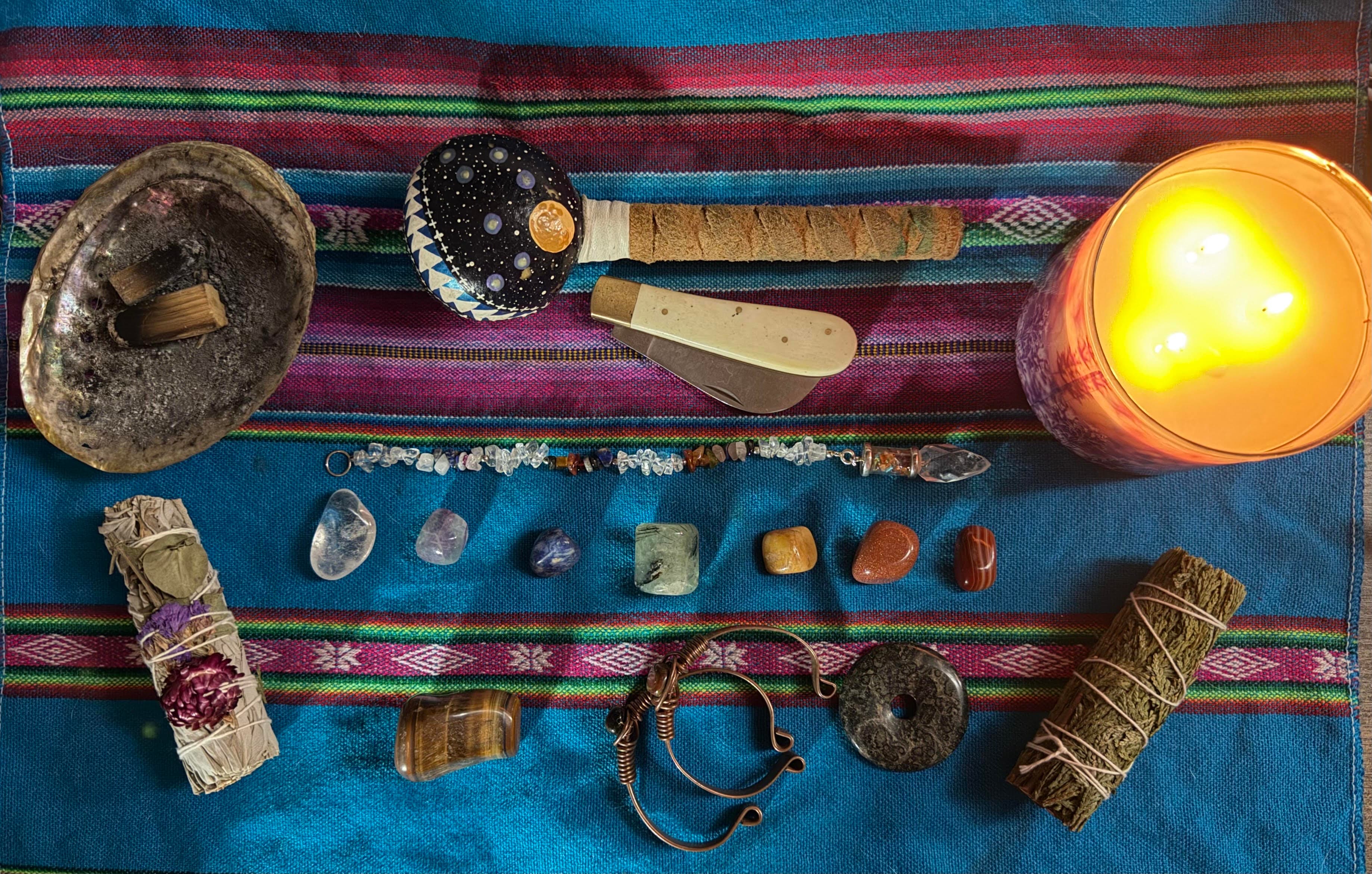 Energetic healing tools on a colorful cloth